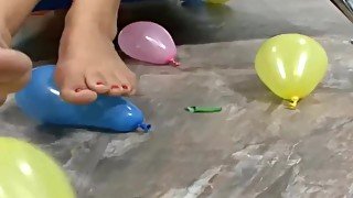 Arianna Jay gives a great footjob and plays with balloons