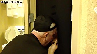 Gloryhole amateur DILF sucks and wanks BFs penis at home