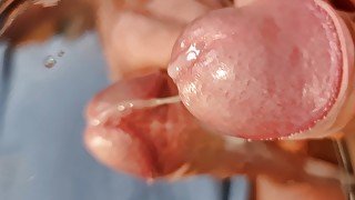 Reflection of huge cumshot in a mirror close-up slow motion