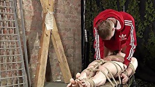 Tied up twink suck cock and used for foot fucking by gay dom