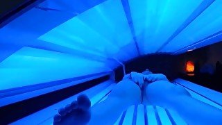 teen latina gets caught rubbing her clit while using a tanning bed