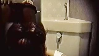 Toilet cam records amateur rubbing pussy through panty