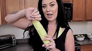 Voluptuous glam girl is naked and toys pussy with a cucumber