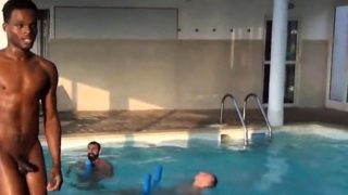 Four men at swimming pool