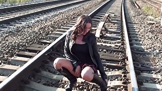 Dirty amateur chick strips and masturbates slit on the rail way