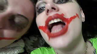 Two crazy clown girls dangle you above their hungry mouths before fighting over who will eat you alive