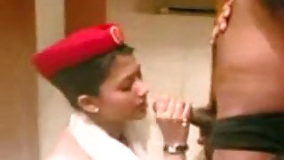 Beautiful Indian lady wearing stewardess uniform gives head in a hotel room