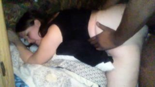 Curvy brunette has a black guy plowing her cunt doggystyle