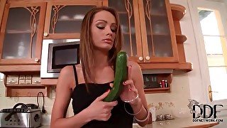 Cute chick cooking and fucking her veggies