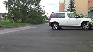 Blonde Pissing Next To A Parked Car