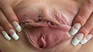 Fuckable brunette doxy brags with huge pink clit in close up scene