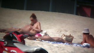 Sexy blonde and naughty brunette on nude beach