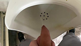 Pissing from an uncut big cock in the office toilet