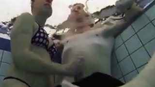 Teen Gives Handjob In Public Pool