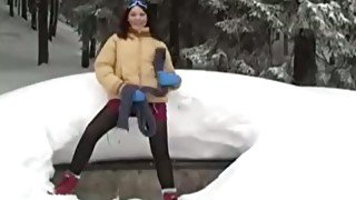 It's so cold outside as this brave hoe masturbates while laying on the snow