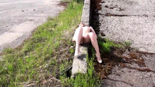 Girl strips naked in a public place