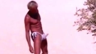 Tanned guy on beach in tiny string thong (temporarily!)