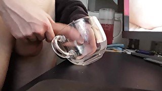 Jerking off a load into a glass mug