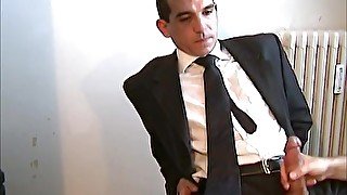 In suit str8 sales agnt gets wanked his big cock by a guy.