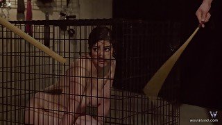 Brunette teen slave let out of the cage to get abused