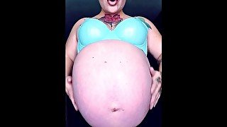 Rubbing Oiled Massive Pregnant Belly