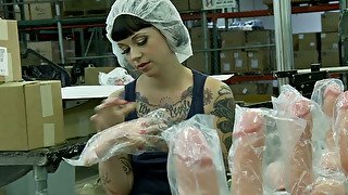 Kinky tattooed brunette worker masturbates in the dildo factory