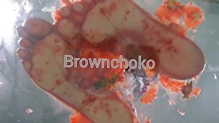 Bare foot food crush Strawberry crush Under glass POV