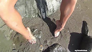 white pantyhose on the public beach