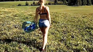 little blonde walks naked in nature and plays with these feet