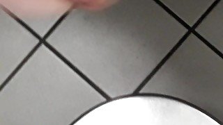 Playing with cock in a public toilet