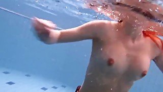 Big tits brunette Mia underwater naked