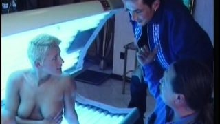 Blonde in a tanning booth gets a stick to eat and gets fucked inside