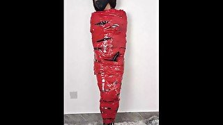 NANA Mummified with red plastic tape and then played with for orgasms