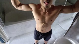 Muscled guy flexes and spreads cum all over his hard body after a workout