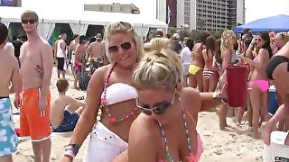 Horny chicks in sexy bikinis getting wild with each other on the beach