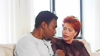 Mature redhead Kira Red is getting black dick