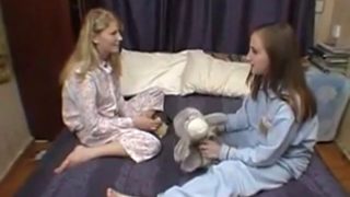 Cute lesbian girls karina and Alya on the bed