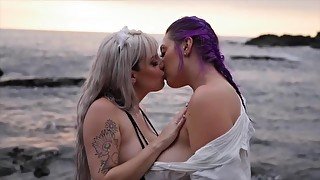 Hot lesbian sunset make out with titty play