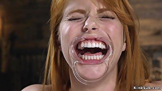 Natural busty redhead whipped in metal stock - Bondage