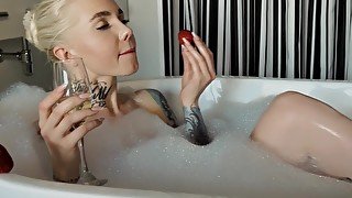 Marina Demidova in a jacuzzi with foam and champagne with strawberries. waiting for you to join