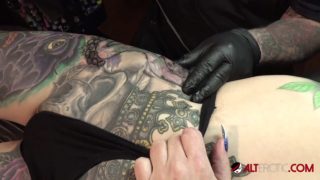 Marie Bossette gets a painful tattoo on her leg