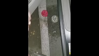 Cumming in public in a parking lot outside