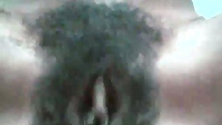 Dirty black whore with hairy cunt is masturbating on webcam