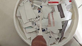 Pissing onto ripped papers