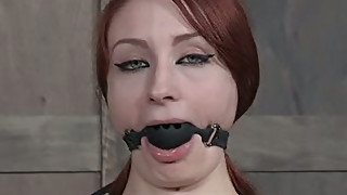 Slutty redhead Violet Monroe really enjoys having a ball gag in her mouth