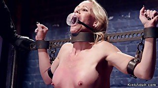 Housewife gagged in metal stock whipped