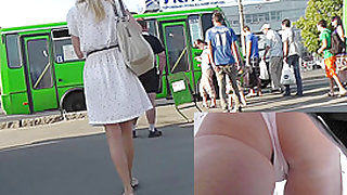 Blonde-haired girl with slender forms in upskirts video