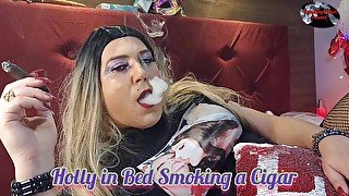 Holly in Bed Smoking a Cigar