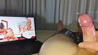 Stroking a big cock while watching porn