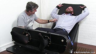 Muscular business man gets undressed and tickled by a pervert